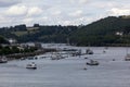 River Dart View, Looking Up River at the Dartmouth Marina, Passenger Ferries and the Wooded Valley Sides. Dartmouth, Devon, Englan