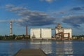 large grain elevators and long chimneys