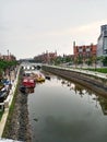 The river in the middle of the settlement provides beauty and coolness, making it suitable as a means of tourist transportation.