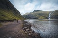 River delta with black sand beach, rocks and high cliffs in Faroe islands, close to village Saksun in Faroese island