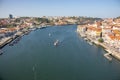 River Douro with embankment of Porto and boats. Old buildings with brick roofs by river Douro in Porto, Portugal. Royalty Free Stock Photo