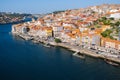 River Douro with embankment of Porto and boats. Old buildings with brick roofs by river Douro in Porto, Portugal. Royalty Free Stock Photo