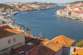 River Douro with embankment of Porto and boats. Old buildings with brick roofs by river Douro in Porto, Portugal. Royalty Free Stock Photo