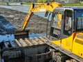 River dredging with tracked excavator