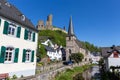 River elz with half-timbered houses and church in Monreal