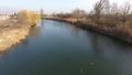 River eric current in the village in the spring. Shallow river, slowly flowing in the village. Royalty Free Stock Photo