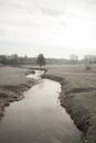 The River Evenlode on a cold frosty morning at Cornbury Park in Charlbury, Oxfordshire in the UK
