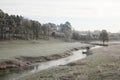 The River Evenlode on a cold frosty morning at Cornbury Park in Charlbury, Oxfordshire in the UK