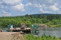 River ferry transports timber.