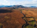 River in fields at mountains in ireland