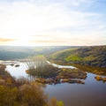 river flow through prairie canyon at the sunset Royalty Free Stock Photo