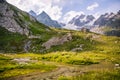 River Flowing in Green Landscape with Shelter and Iconic Mont-Blanc Glacier in the Background Royalty Free Stock Photo