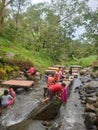 River flowing in trawas river mojokerto ijawa timur indonesia children playing i stone rocks