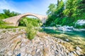 River flowing under ancient bridge Royalty Free Stock Photo