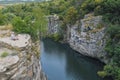 The river flows through a canyon with large stones and rocks Royalty Free Stock Photo