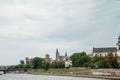 The river flows through the city. Church on the hill above the river. Wisla River in Krakow. Float the boat and the ship Royalty Free Stock Photo