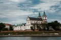 The river flows through the city. Church on the hill above the river. Wisla River in Krakow. Float the boat and the ship under wat Royalty Free Stock Photo