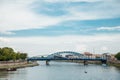 The river flows through the city. Church on the hill above the river. Wisla River in Krakow. Float the boat and the ship Royalty Free Stock Photo