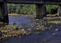 Calm and beauty River flows under a historic bridge