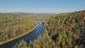 River and forest in autumn Sigulda city nature, Gauya, 4K drone flight, bridge car drive from above