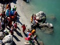 Religious Hindus taking Holy dip in River Ganga at Rishikesh, India