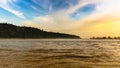 River Ganga / Ganges flowing in full force at Triveni Ghat, Rishikesh, Uttarakhand, Royalty Free Stock Photo