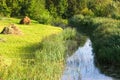 River and hayfield Royalty Free Stock Photo