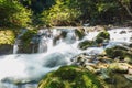 A river headwaters flows over rocks Royalty Free Stock Photo