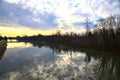 River in the italian countryside in winter with the sky casted in the water Royalty Free Stock Photo