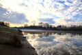 River in the italian countryside in winter with the sky casted in the water Royalty Free Stock Photo