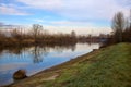 River in the italian countryside in winter with the sky casted in the water Royalty Free Stock Photo