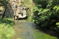 River Kamenice flowing among rocks in forest Royalty Free Stock Photo