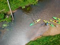 River Kayaker Aerial View. Sportsmans in Kayaks Paddling on the Scenic River