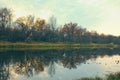 River or lake in early autumn in the forest Royalty Free Stock Photo