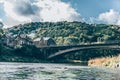 River landscape with old bridge and houses