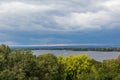 A river landscape. Summer or autumn. Tourist boats. The river Volga in the city Samara, Russia. Heavy clouds in the evening