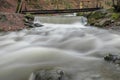 River Long Exposure with Surrounding Forest and Rocks