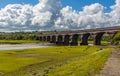 The river Loughor flows serenely beneath the brick arches of the Hendy viaduct at Pontarddulais, Wales Royalty Free Stock Photo