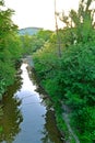 River with a rocky channel and green vegetation