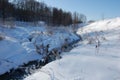 River meandering through snow on a sunny day Royalty Free Stock Photo