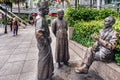 The River merchants, bronze sculpture at the riverbank in Singap Royalty Free Stock Photo