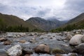 River with mountain torrent and many rocks. Wild nature landscape. Adventure tourism. Tough nature concept.