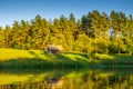 River landscape in spring time, little wooden cabin Royalty Free Stock Photo