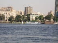 River Nile bank with a background of modern buildings on a sunny summer day and sailing boats, Cairo, Egypt Royalty Free Stock Photo