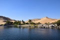 River Nile/ beautiful view for Aswan Egypt and Nubian Egyptian culture. sailing boat sailing in the River Nile and harbor with bir Royalty Free Stock Photo