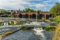 The River Nith flowing over the Caul weir in Dumfries, during summer in Scotland Royalty Free Stock Photo