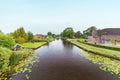 River with old farms in Dutch national park Weerribben Royalty Free Stock Photo