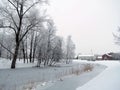 River and old homes in winter, Lithuania Royalty Free Stock Photo