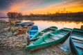 River and old wooden rowing fishing boat at beautiful sunrise in Royalty Free Stock Photo