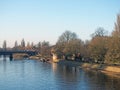 The river ouse in york with people sat along the banks in afternoon sunlight Royalty Free Stock Photo
